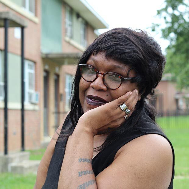 RRHA resident, woman with glasses in community courtyard