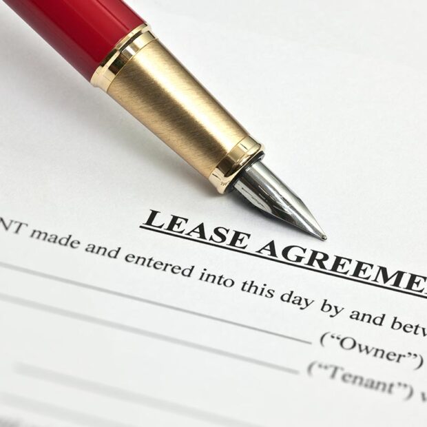 Lease agreement document and pen